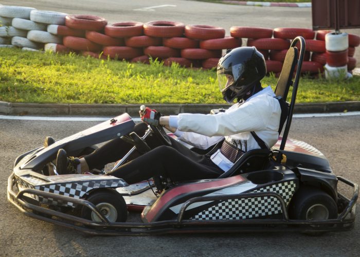 Go cart racing on a track.